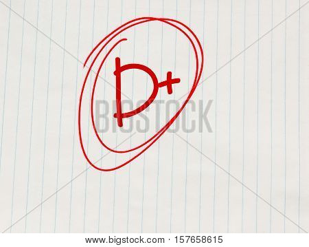 D plus (D+) grade written in red on notebook paper