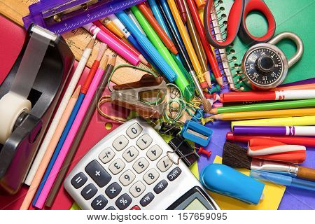 Full background of a colorful assortment of school supplies