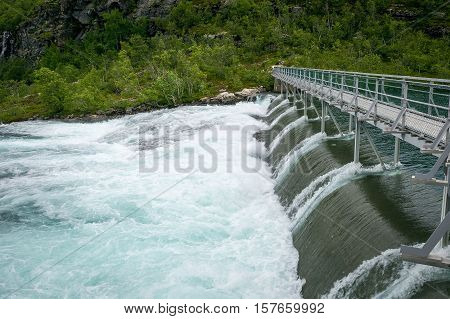 Kjosfossen dam. Upper point of famous huge norwegian waterfall, popular travel destination. Aurland, Flam, Norway