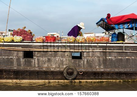 CAN THO, VIETNAM - FEB. 4: Vietnamese selling produce at the Floating Market in Can Tho, Vietnam on February 4, 2016. Cai Rang Floating Market is the biggest floating market in the Mekong Delta.