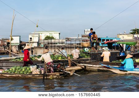 CAN THO, VIETNAM - FEB. 4: Vietnamese selling produce at the Floating Market in Can Tho, Vietnam on February 4, 2016. Cai Rang Floating Market is the biggest floating market in the Mekong Delta.