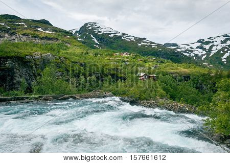 Mountain river and upper point of Kjosfossen waterfall. Norwegian landscape.