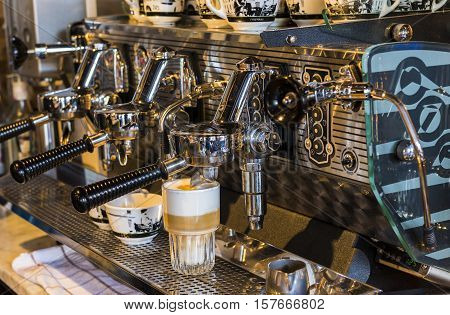 Houten The Netherlands - August 26 2016: Making coffee on a professional coffee machine for cappuccino and espresso.