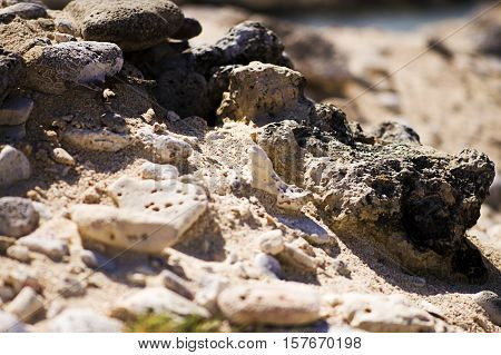 Interesting rock formation. Stones and sand at the beach