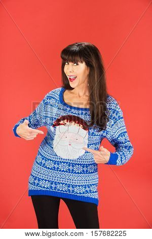 Happy Woman Pointing To Her Sweater