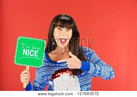 Happy Woman Pointing To A Nice Sign