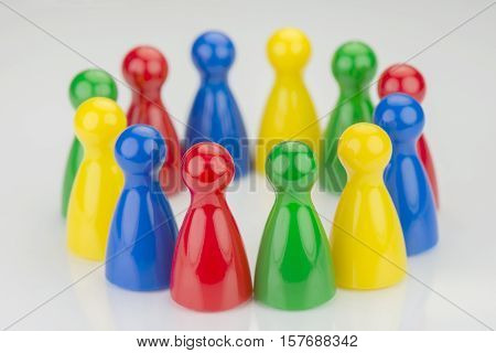 Conceptual game pawns that visualize the concept chain cooperation