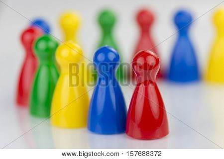 Conceptual game pawns that visualize the concept chain cooperation