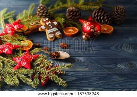 Christmas Gingerbread Cookies Against Background Branch Of Fir Tree And Sparks Of Christmas Garland