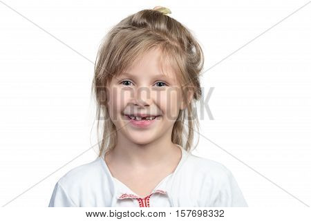 Portrait of a beautiful smiling child girl with no front teeth isolated on white background
