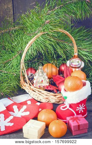 Branches of a Christmas tree on old boards. Christmas background. Christmas Socks. Christmas decorations. 2017 year. New Year background. Xmax background. Toned image.