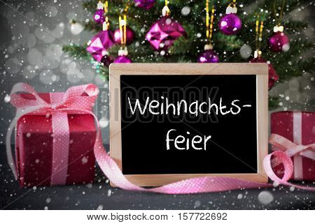 Chalkboard With German Text Weihnachtsfeier Means Christmas Party. Christmas Tree With Rose Quartz Balls, Snowflakes And Bokeh Effect. Gifts Or Presents In The Front Of Cement Background.