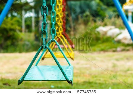 Empty chain swing in playground public park.