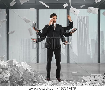 Businessman that to solve problems become multitasking with documents of bureaucracy and paperwork on background