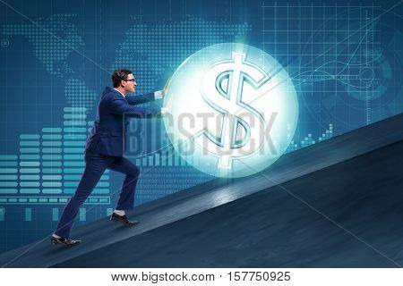 Businessman pushing away dollar ball