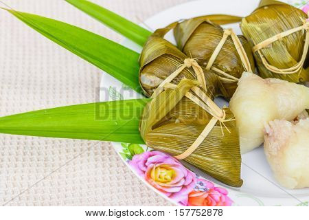 Traditional Thai food style Thai dessert made from banana and glutinous rice wrap with pandan (Khao Tom Mat)