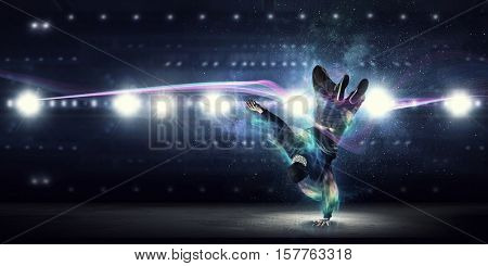 B-boy performing some moves . Mixed media