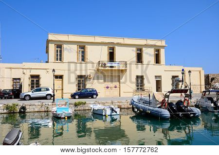 RETHYMNO, CRETE - SEPTEMBER 15, 2016 - Boats in the inner harbour with the customs house to the rear Rethymno Crete Greece Europe, September 15, 2016.