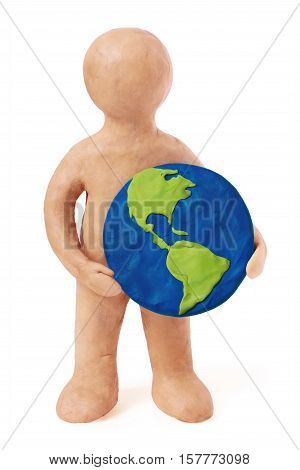 Plasticine man holding earth USA Ameria part on a white background