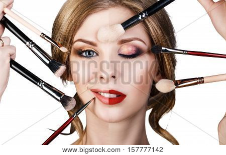 Many hands with cosmetics brushes applying make-up to glamour woman, isolared on white