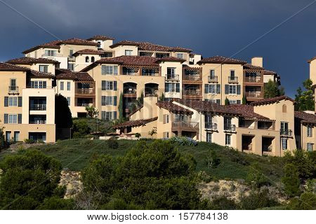 Modern contemporary condominiums taken on a hill surrounded by lush green gardens