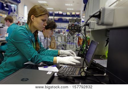 ST. PETERSBURG, RUSSIA - NOVEMBER 16, 2016: Researchers at work in the High-Throughput Biotechnology Laboratory of BIOCAD. It is one of the full-cycle drug development and manufacturing companies