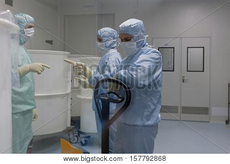 ST. PETERSBURG, RUSSIA - NOVEMBER 16, 2016: Staff working in clean area in the production site of the biotechnology company BIOCAD. It is one of full-cycle drug development and manufacturing companies