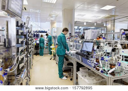ST. PETERSBURG, RUSSIA - NOVEMBER 16, 2016: Researchers at work in the High-Throughput Biotechnology Laboratory of BIOCAD. It is one of the few full-cycle drug development and manufacturing companies