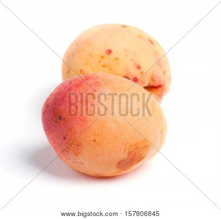 Real apricots isolated on white background