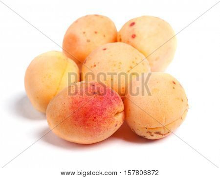 Real apricots isolated on white background