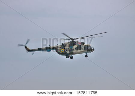 Vasilkov Ukraine - April 24 2012: Ukrainian Air Force Mi-8 medevac helicopter is landing in clear sky