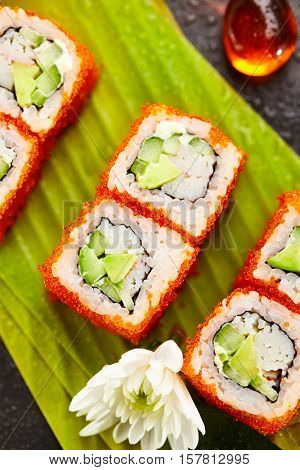 California Maki Sushi with Masago - Roll made of Crab Meat, Avocado, Cucumber, Japanese Mayonnaise inside. Masago (smelt roe) outside