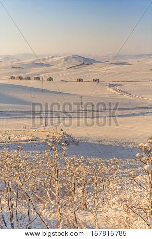 RURAL LANDSCAPE WINTER. Between Apulia and Basilicata. snowy hills landscape with farmhouses. ITALY.