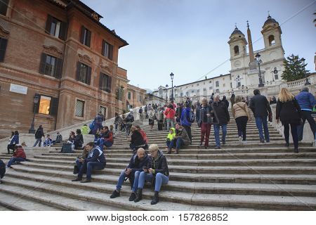 ROME ITALY - NOVEMBER 8 : large number of tourist sitting on spanish step important traveling landmark and shopping point on november 8 2016 in rome italy