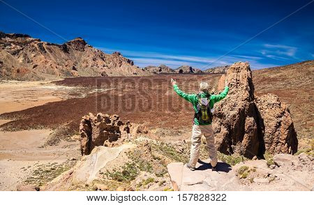 Tourist Man With Opened Arms At The Liano De Ucanca Mountains