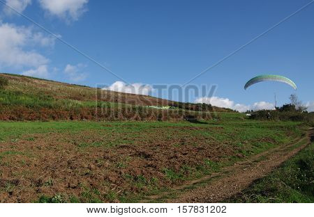 ROCCA PRIORA ITALY - NOVEMBER 1 2016: paragliding lesson paraglider landing after a training flight