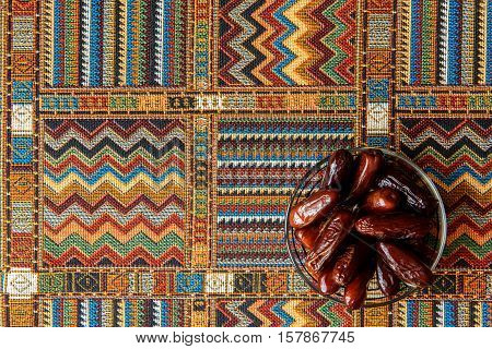 sweets and dates on a traditional Arabian tablecloths