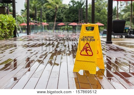 Yellow Wet Floor Warning Sign On The Floor In Hotel