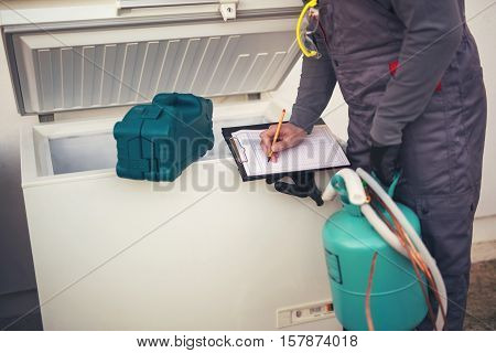 Repairs freezer entering malfunction in a workshop