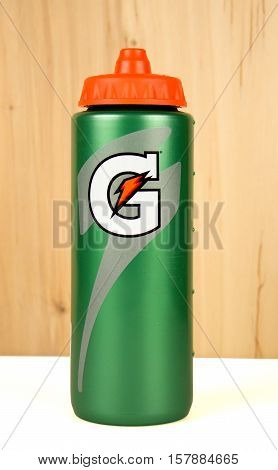 RIVER FALLS,WISCONSIN-NOVEMBER 22,2016: A plastic Gatorade brand hydration bottle with wood background.