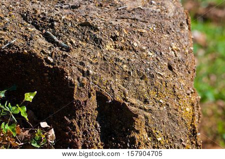Large rough rock bolder outdoors in nature.