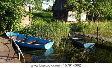 Beautiful lake boat. Camping Russia. Holidays in Sunny day on a quiet lake.