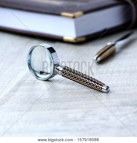 Stationery Magnifier On A Grey Background