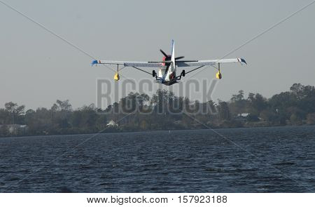 A Seaplane approaches the water for a landing at a festival in Bridgeton North Carolina