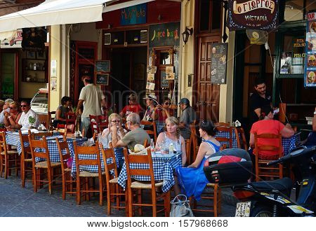 RETHYMNO, CRETE - SEPTEMBER 15, 2016 - Tourists relaxing at restaurants in the old town Rethymno Crete Greece Europe, September 15, 2016.