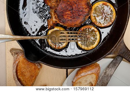 Pork Chop Seared On Iron Skillet