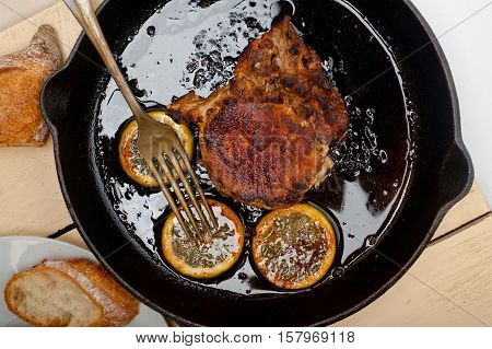 Pork Chop Seared On Iron Skillet