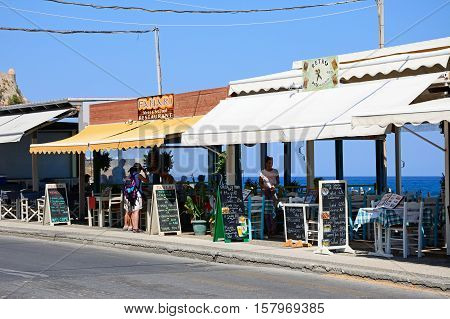 RETHYMNO, CRETE - SEPTEMBER 15, 2016 - Pavement cafes along the seafront Periferiakos Rethymno Crete Greece Europe, September 15, 2016.