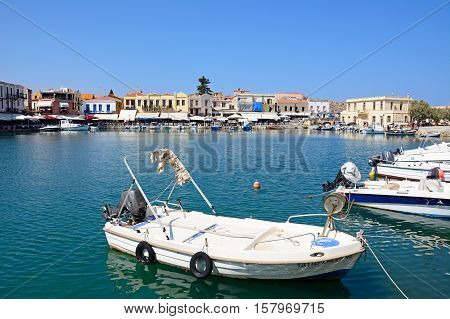 RETHYMNO, CRETE - SEPTEMBER 15, 2016 - View of boats and waterfront restaurants in the inner harbour Rethymno Crete Greece Europe, September 15, 2016.