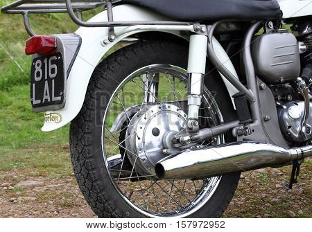 Norton Dominator - Classic British Motorcycle. Photographed at Coleford Carnival of Transport, England. 10th April 2009. (rear wheel assembly, brake drum, exhaust offside)